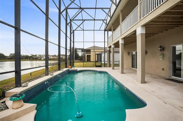 a swimming pool with outdoor seating