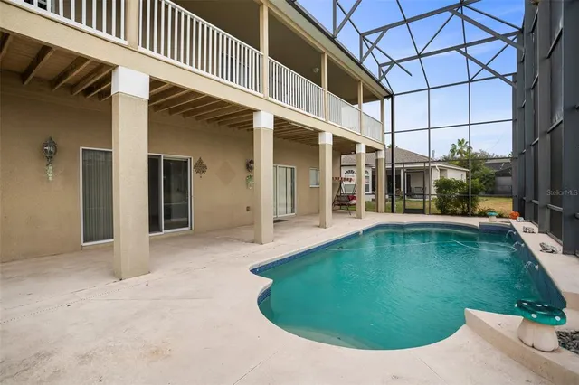 an outdoor view with swimming pool and porch