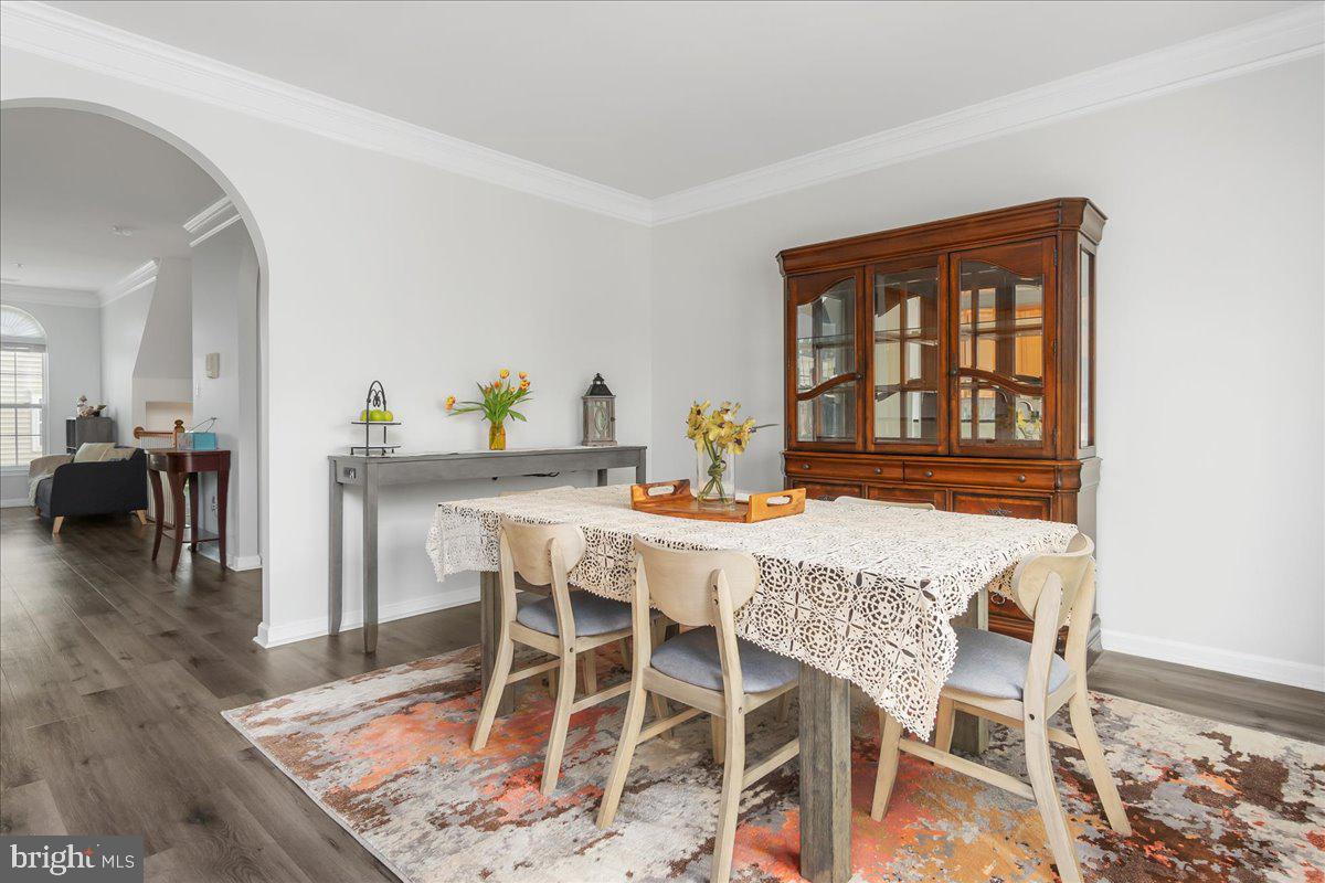 1874 Monocacy View Circle, Unit 28B Frederick, MD 21701 - Photo 11 of 35 a dining room with furniture and wooden floor