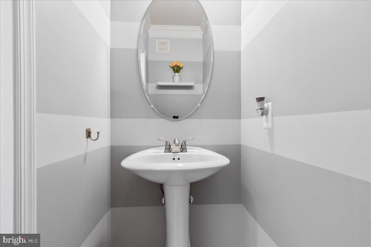 1874 Monocacy View Circle, Unit 28B Frederick, MD 21701 - Photo 13 of 35 a bathroom with a sink and a mirror