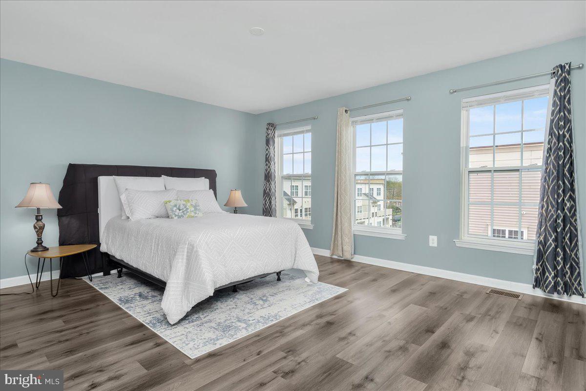 1874 Monocacy View Circle, Unit 28B Frederick, MD 21701 - Photo 14 of 35 a bedroom with a bed and windows