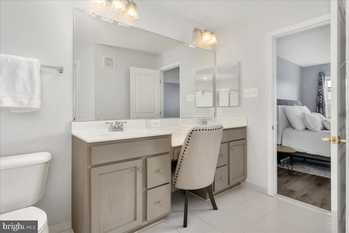 1874 Monocacy View Circle, Unit 28B Frederick, MD 21701 - Photo 18 of 35 a bathroom with a sink toilet and a mirror