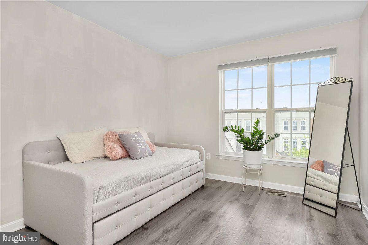 1874 Monocacy View Circle, Unit 28B Frederick, MD 21701 - Photo 20 of 35 a living room with furniture and a window