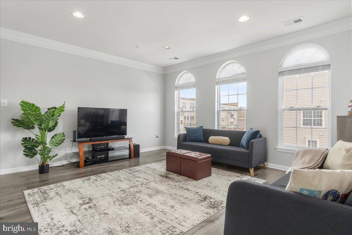 1874 Monocacy View Circle, Unit 28B Frederick, MD 21701 - Photo 2 of 35 a living room with furniture and a flat screen tv