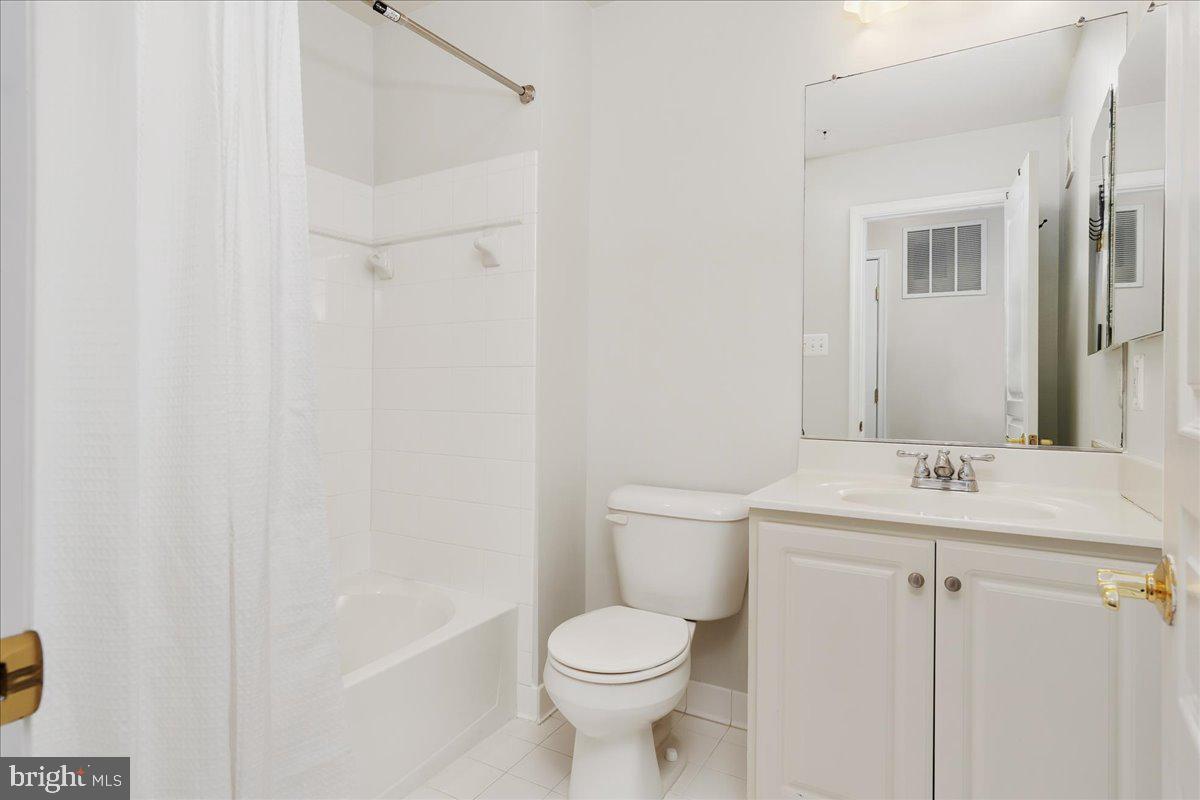 1874 Monocacy View Circle, Unit 28B Frederick, MD 21701 - Photo 21 of 35 a bathroom with a toilet sink and mirror