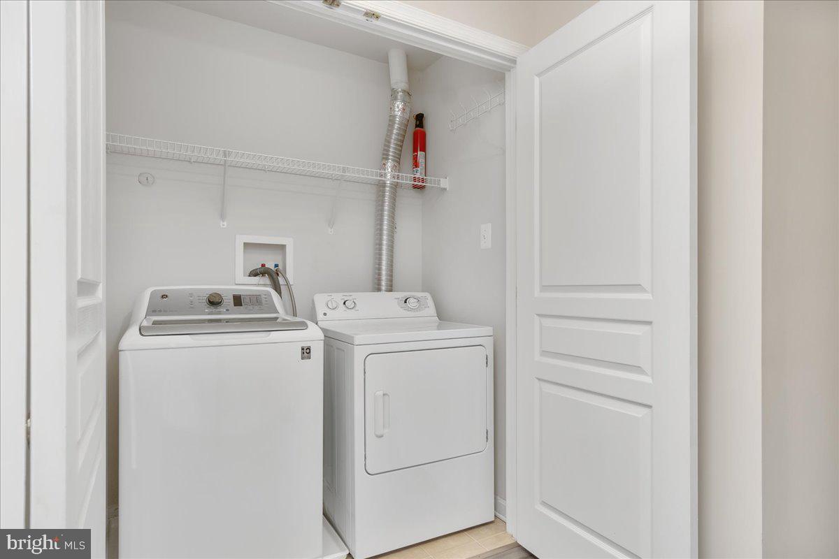 1874 Monocacy View Circle, Unit 28B Frederick, MD 21701 - Photo 22 of 35 a utility room with dryer and washer