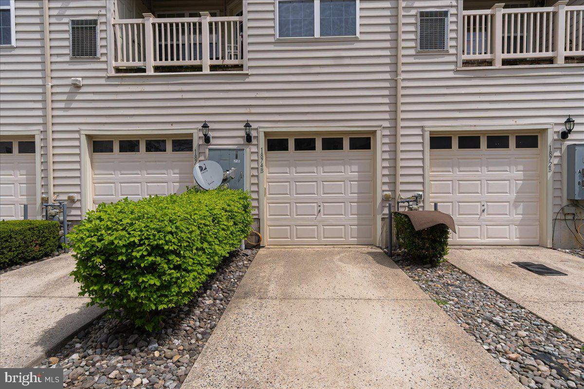 1874 Monocacy View Circle, Unit 28B Frederick, MD 21701 - Photo 23 of 35 a front view of a house with a yard