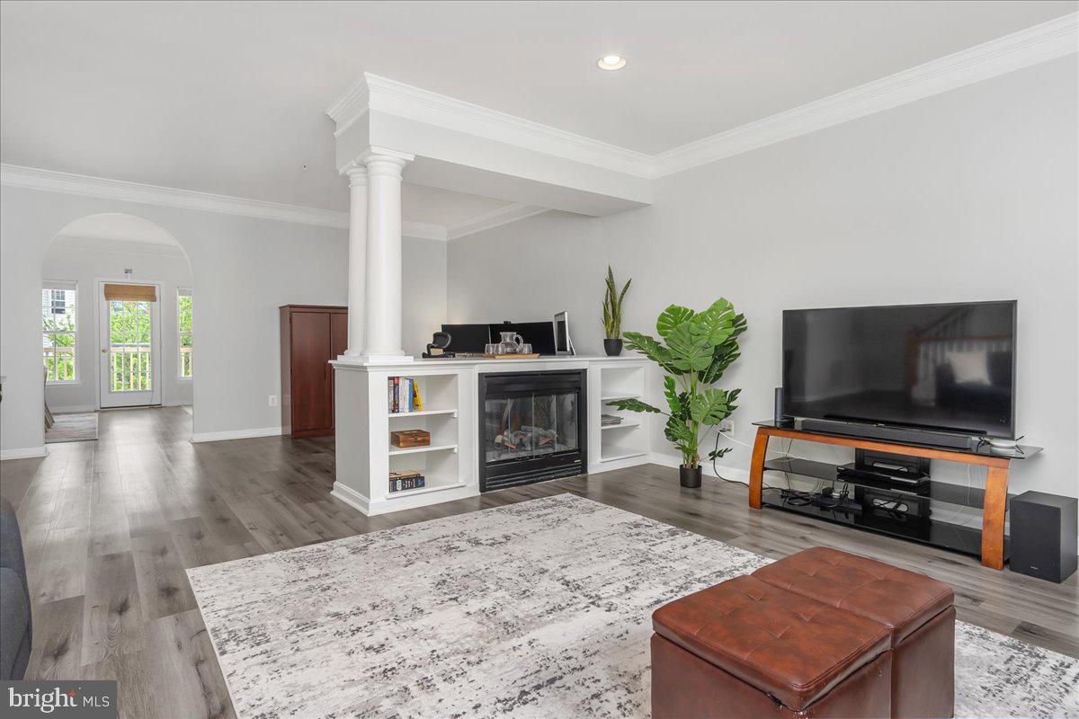 1874 Monocacy View Circle, Unit 28B Frederick, MD 21701 - Photo 3 of 35 a living room with furniture a fireplace and a flat screen tv