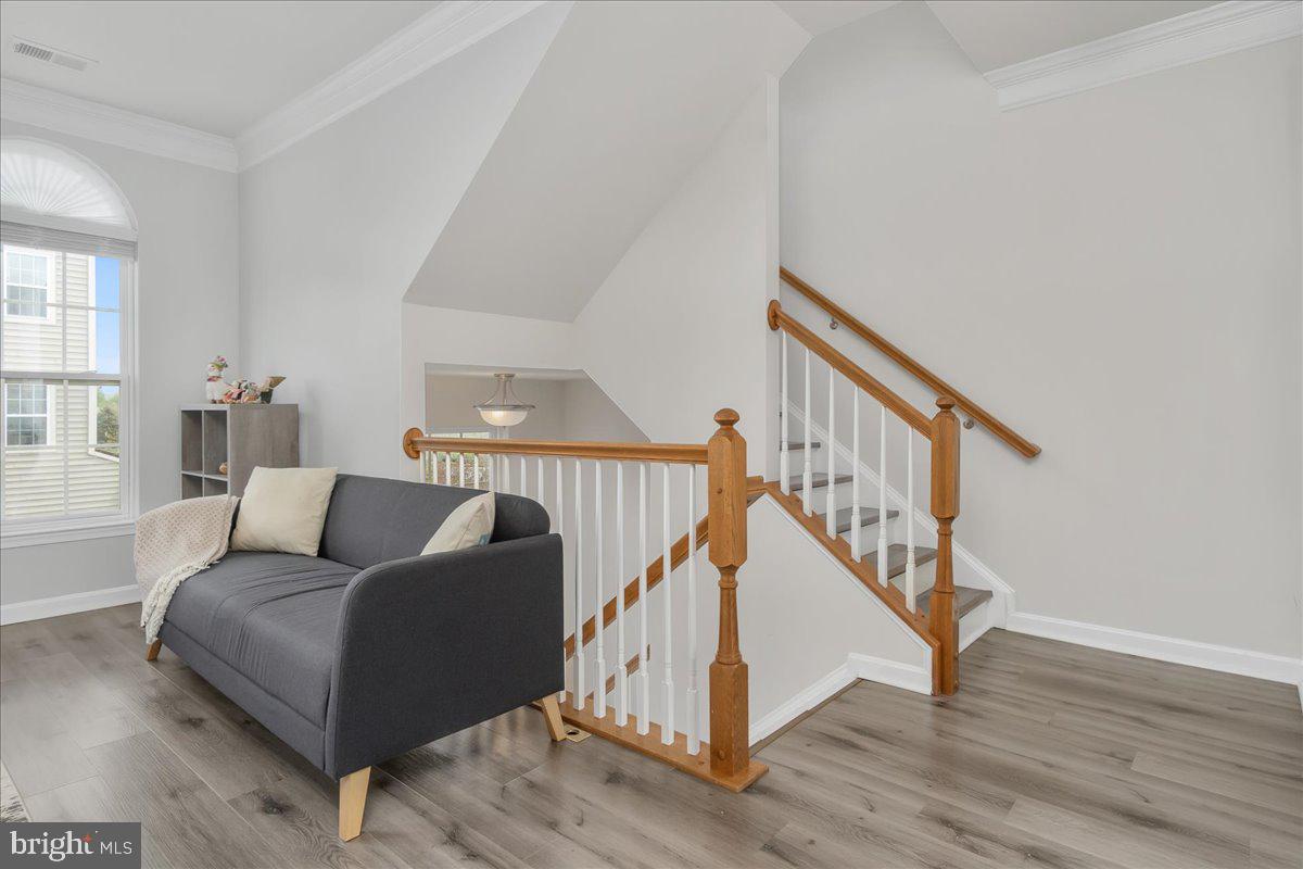 1874 Monocacy View Circle, Unit 28B Frederick, MD 21701 - Photo 6 of 35 a living room with furniture and a wooden floor