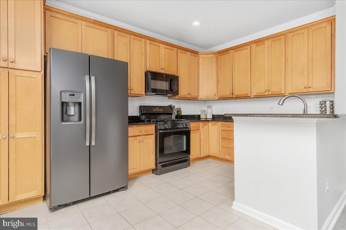 1874 Monocacy View Circle, Unit 28B Frederick, MD 21701 - Photo 7 of 35 a kitchen with stainless steel appliances a refrigerator sink and microwave