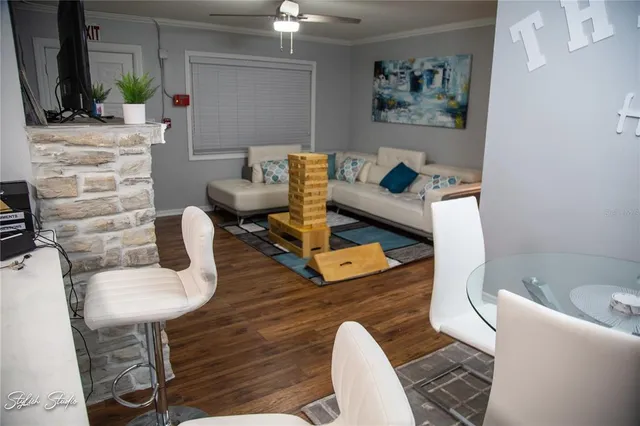 a living room with furniture and a flat screen tv