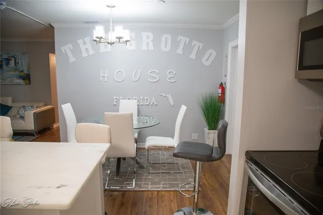 a view of kitchen and dining area with chandelier
