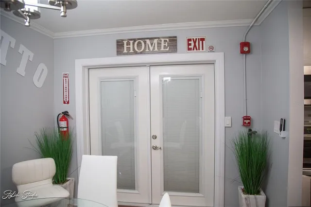 a view of a hallway with furniture