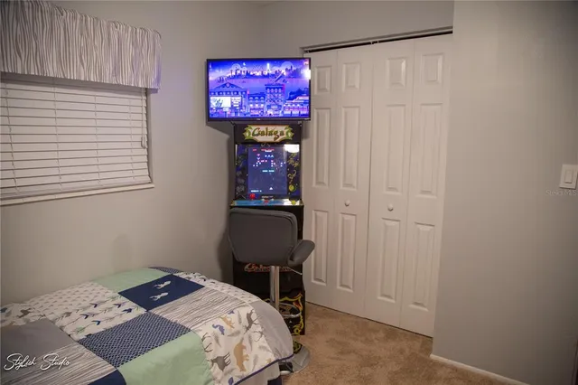 a bedroom with a bed and a table in it