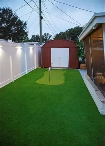 a backyard of a house with lots of green space