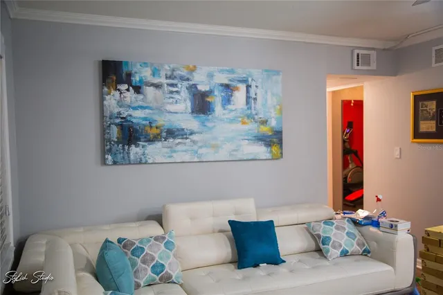 a living room with furniture and a couch