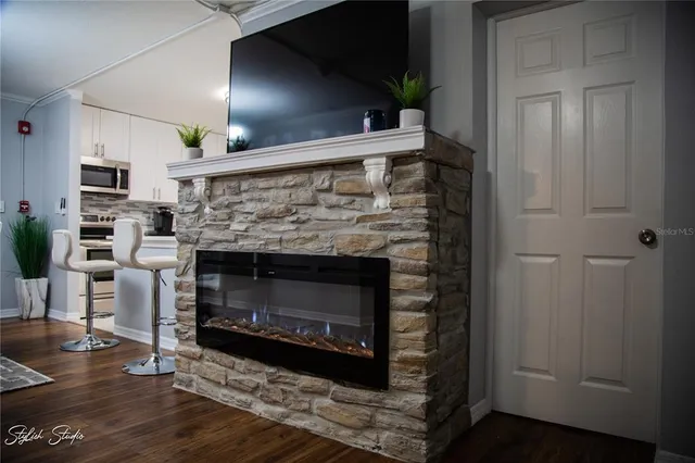 a living room with furniture and a fireplace