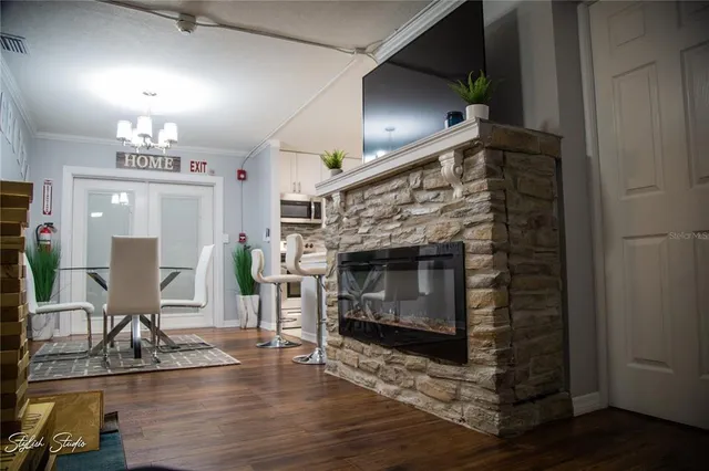 a view of a livingroom with furniture and a fireplace