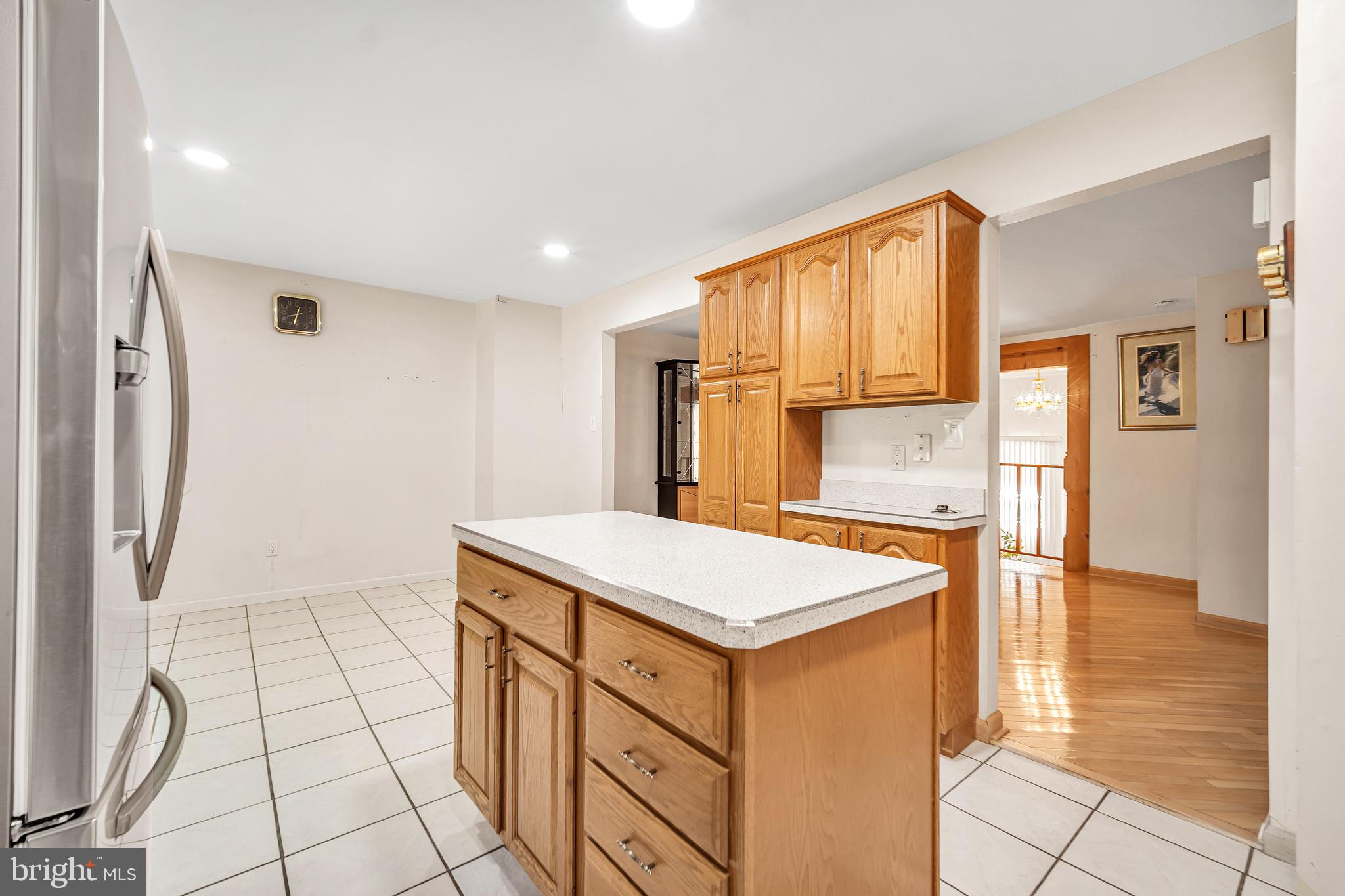 518 Pebble Ridge Court Langhorne, PA 19053 - Photo 12 of 31 a kitchen with stainless steel appliances granite countertop a sink and a stove with white countertops