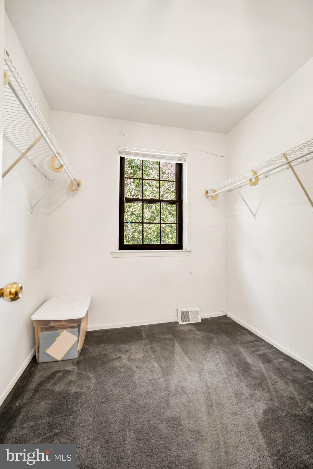 518 Pebble Ridge Court Langhorne, PA 19053 - Photo 18 of 31 an empty room with windows and exposed radiator