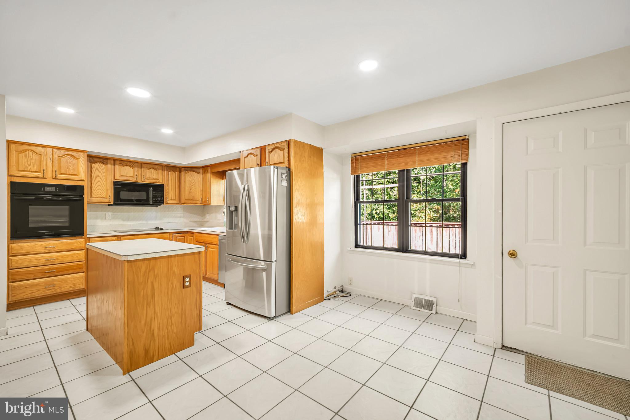 518 Pebble Ridge Court Langhorne, PA 19053 - Photo 9 of 31 a kitchen with stainless steel appliances granite countertop a refrigerator and a sink