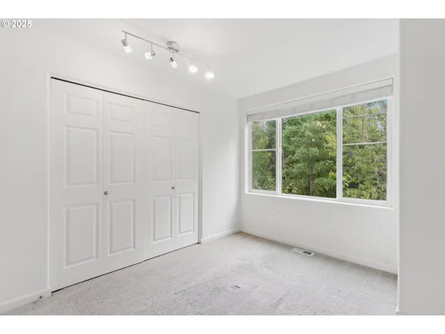a bathroom with a sink toilet vanity and shower