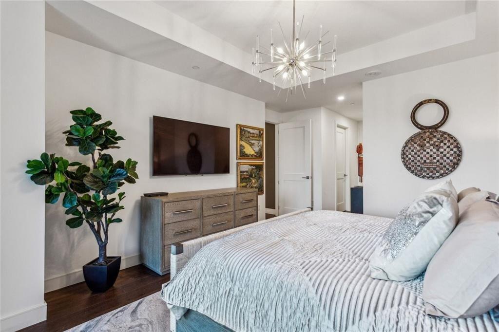 2520 Peachtree Road, Unit 602 Atlanta, GA 30305 - Photo 14 of 45 a bedroom with a bed and a television