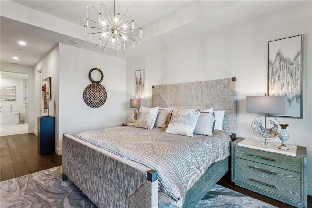 2520 Peachtree Road, Unit 602 Atlanta, GA 30305 - Photo 15 of 45 a bedroom with a bed and a lamp on dresser