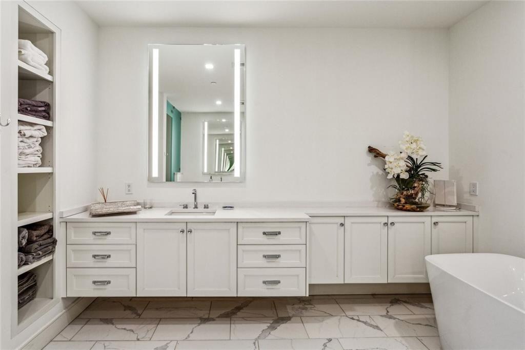2520 Peachtree Road, Unit 602 Atlanta, GA 30305 - Photo 18 of 45 a bathroom with a sink a vanity and a mirror