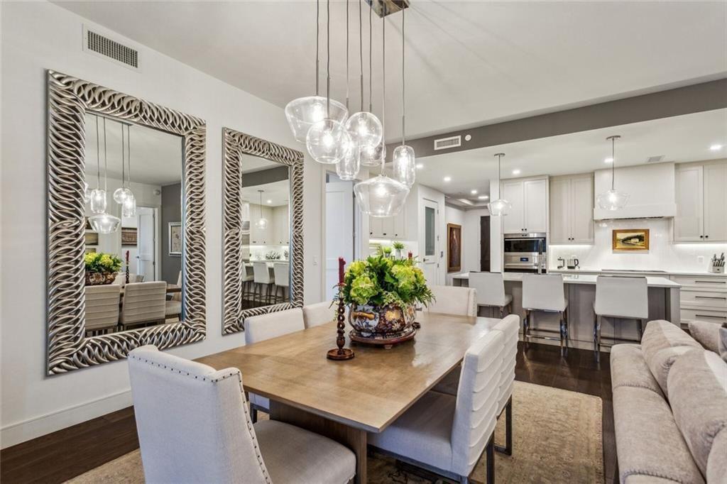 2520 Peachtree Road, Unit 602 Atlanta, GA 30305 - Photo 6 of 45 a view of a dining room with furniture and a chandelier