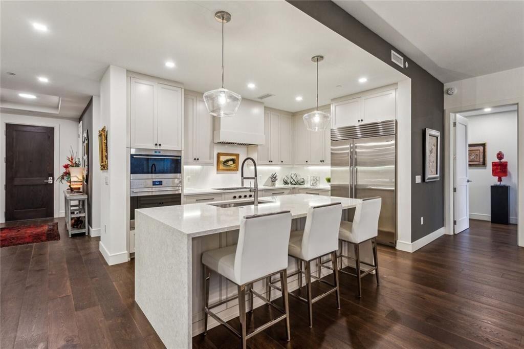 2520 Peachtree Road, Unit 602 Atlanta, GA 30305 - Photo 9 of 45 a large kitchen with a table and chairs