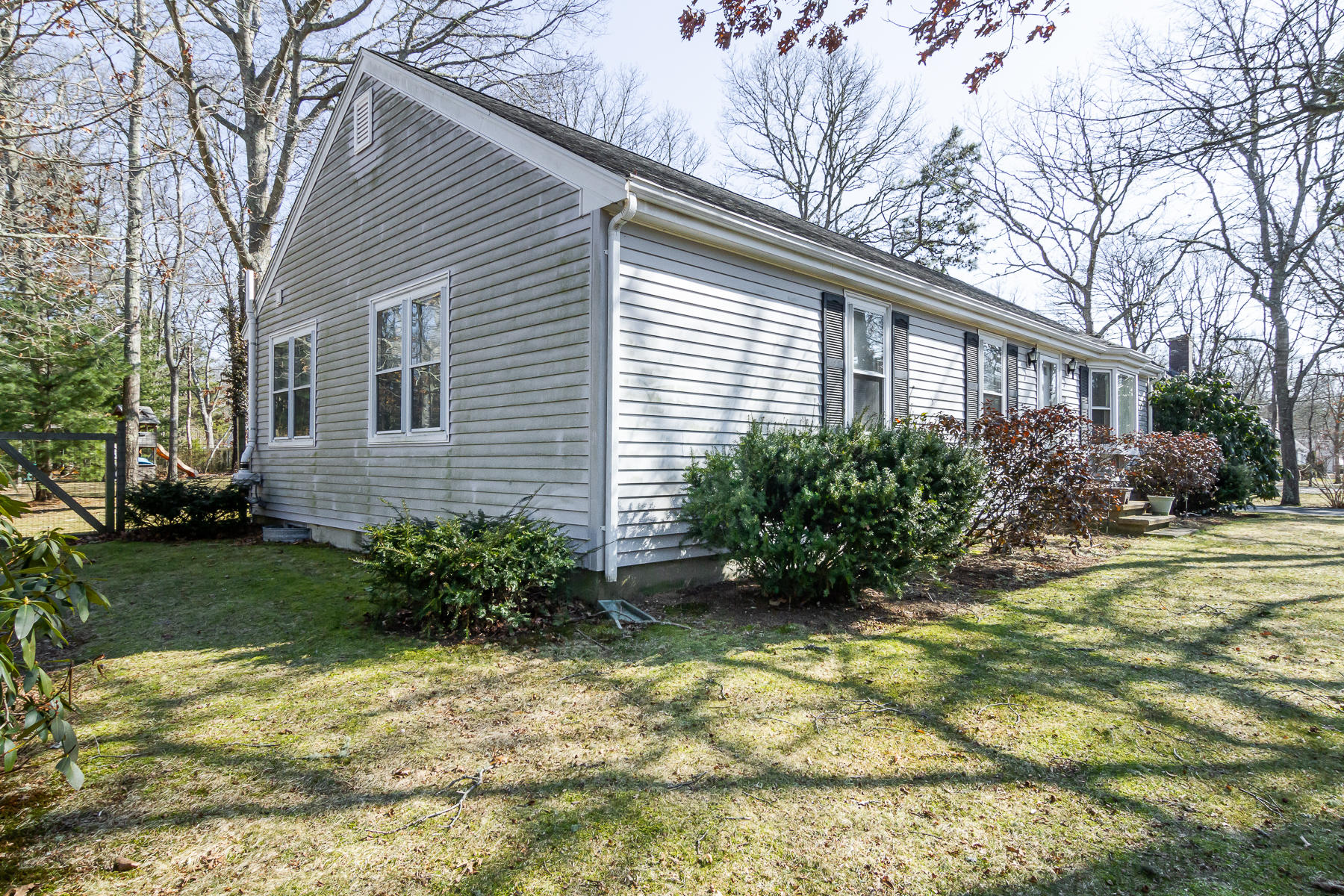 212 Skunknet Road Centerville, MA 02632 - Photo 3 of 45 a view of a house with backyard and garden