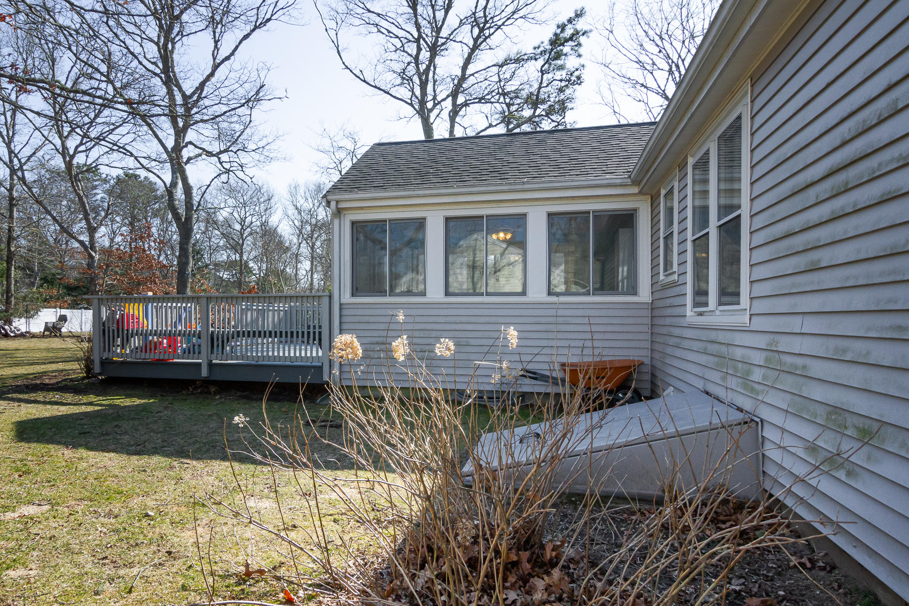 212 Skunknet Road Centerville, MA 02632 - Photo 7 of 45 a front view of a house with a yard