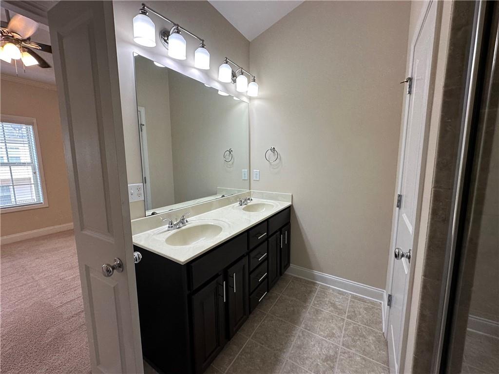 2417 Tenor Lane Alpharetta, GA 30009 - Photo 24 of 43 a bathroom with a sink vanity and a mirror