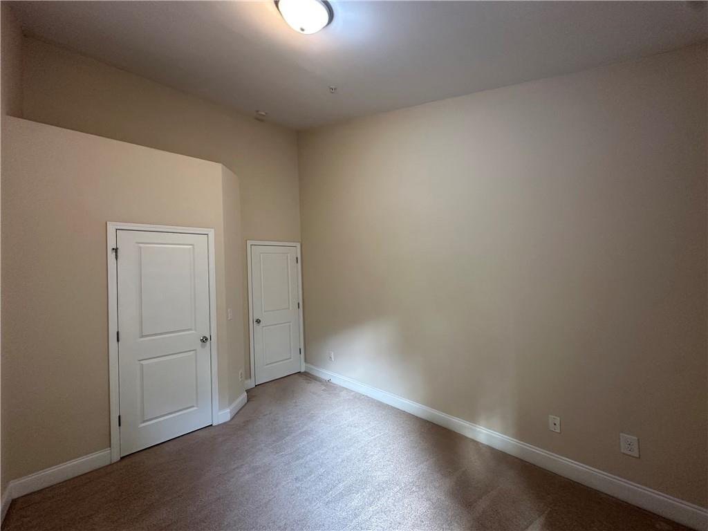 2417 Tenor Lane Alpharetta, GA 30009 - Photo 32 of 43 an empty room with wooden floor