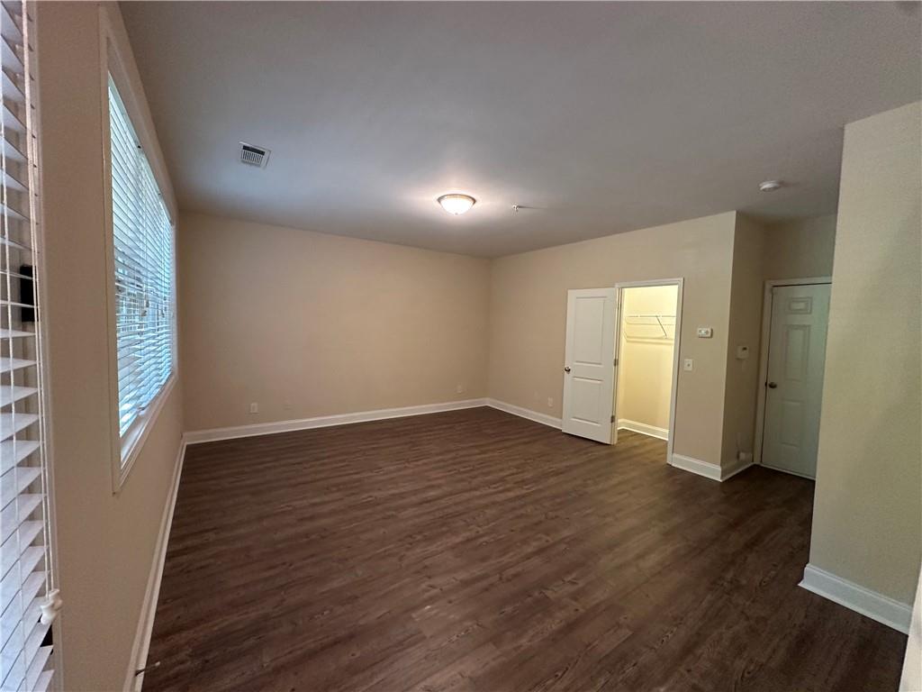2417 Tenor Lane Alpharetta, GA 30009 - Photo 37 of 43 a view of an empty room with wooden floor and a window