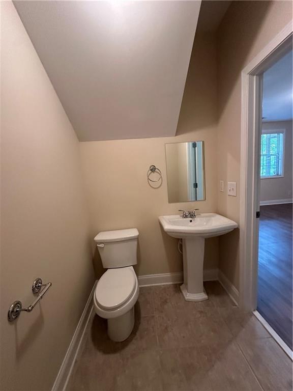 2417 Tenor Lane Alpharetta, GA 30009 - Photo 40 of 43 a bathroom with a sink toilet and a mirror