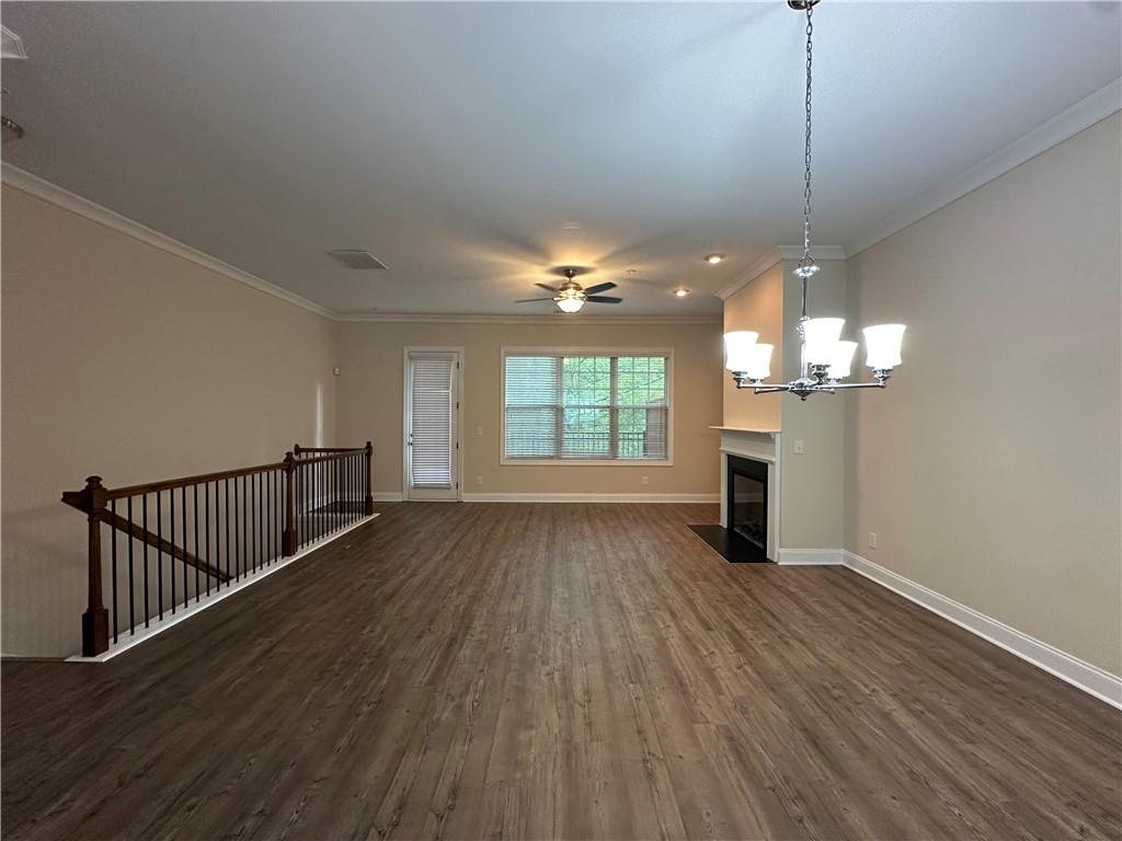 2417 Tenor Lane Alpharetta, GA 30009 - Photo 6 of 43 a view of a room with wooden floor fireplace and windows