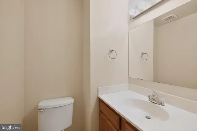 a bathroom with a sink toilet and vanity