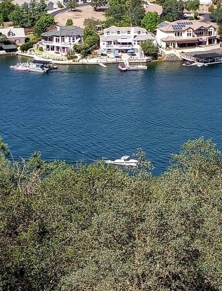 4983 Pueblo Trail Copperopolis, CA 95228 - Photo 4 of 23 a view of a lake with houses