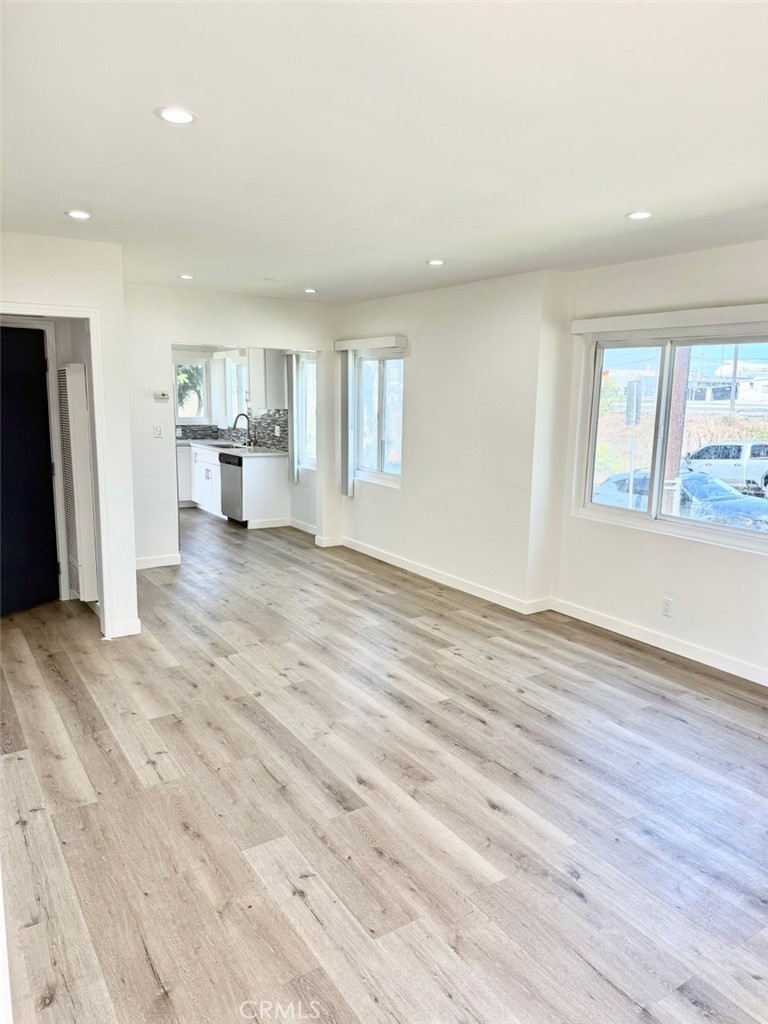 1112 East Imperial Avenue El Segundo, CA 90245 - Photo 2 of 10 a view of a livingroom with wooden floor and a window