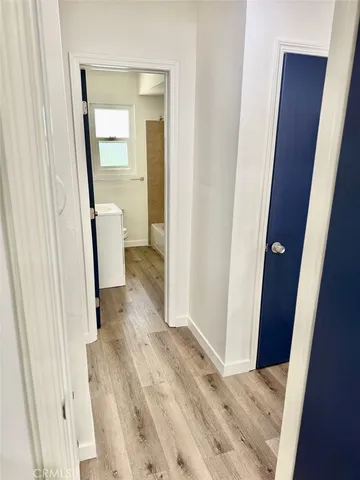 a view of a bathroom from a hallway