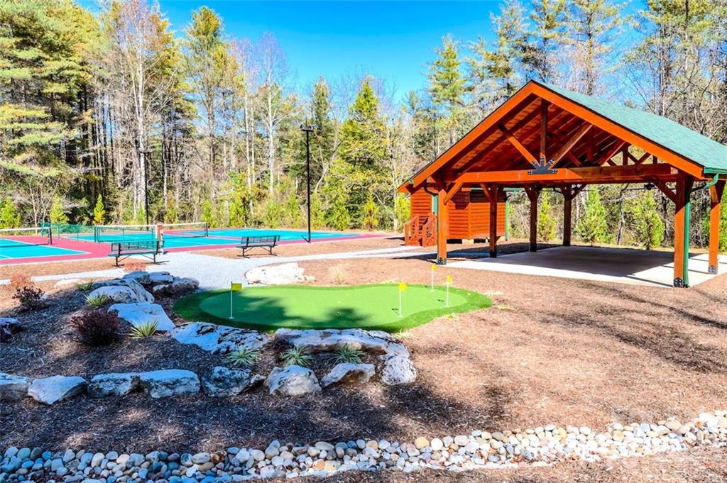 2032 Shadow Ridge Trail, Unit LOT G40 Lenoir, NC 28645 - Photo 5 of 25 a front view of a house with a yard and lake view
