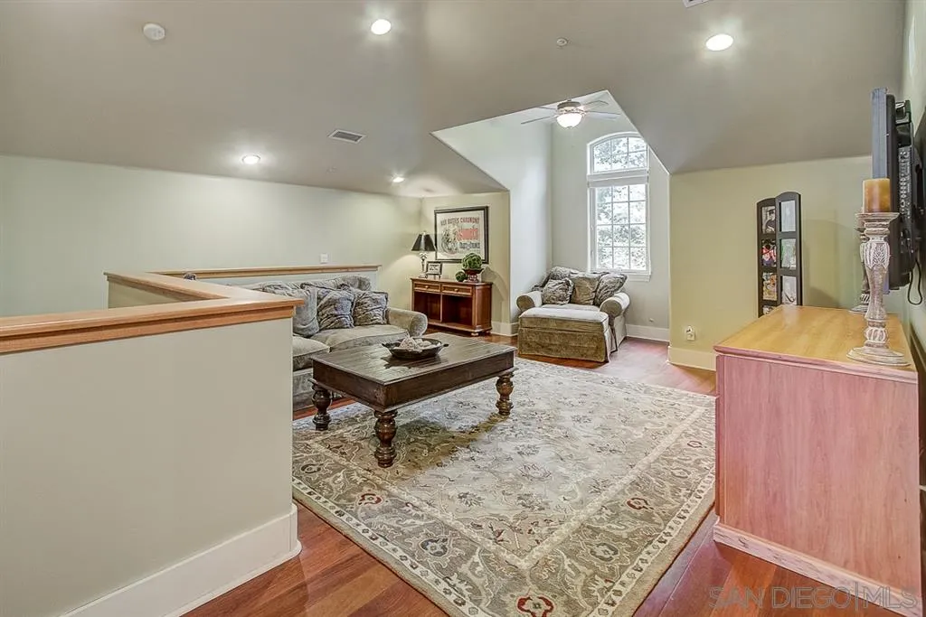15165 Saddlebrook Lane Poway, CA 92064 - Photo 13 of 25 a living room with a table and a couch