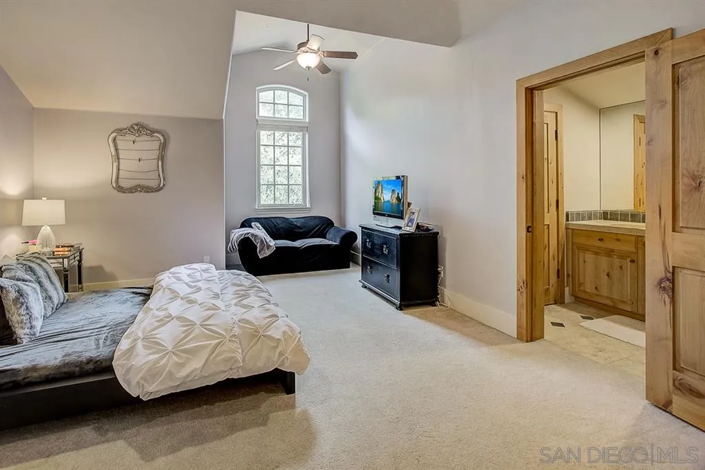 15165 Saddlebrook Lane Poway, CA 92064 - Photo 16 of 25 a bedroom with furniture and a window