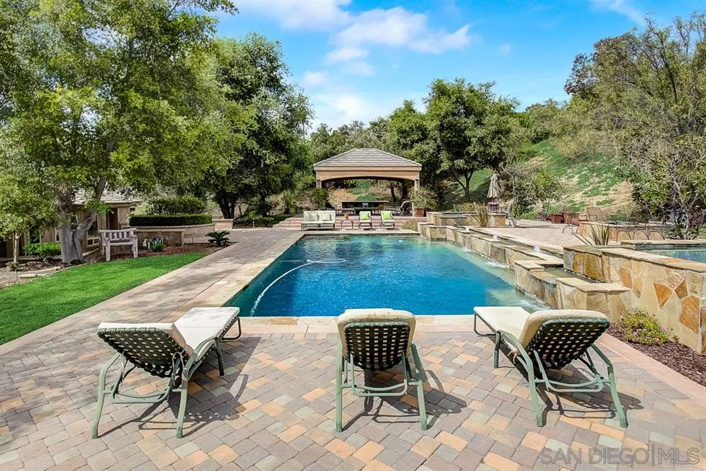 15165 Saddlebrook Lane Poway, CA 92064 - Photo 19 of 25 a view of a swimming pool with lounge chair