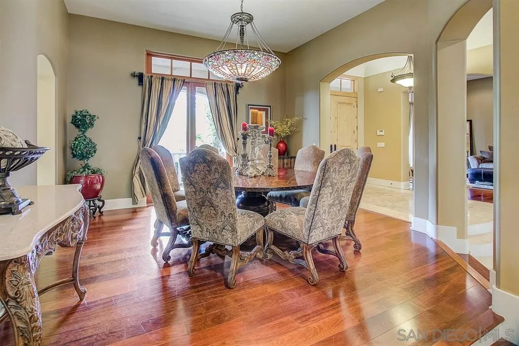 15165 Saddlebrook Lane Poway, CA 92064 - Photo 7 of 25 a view of a dining room with furniture window and wooden floor