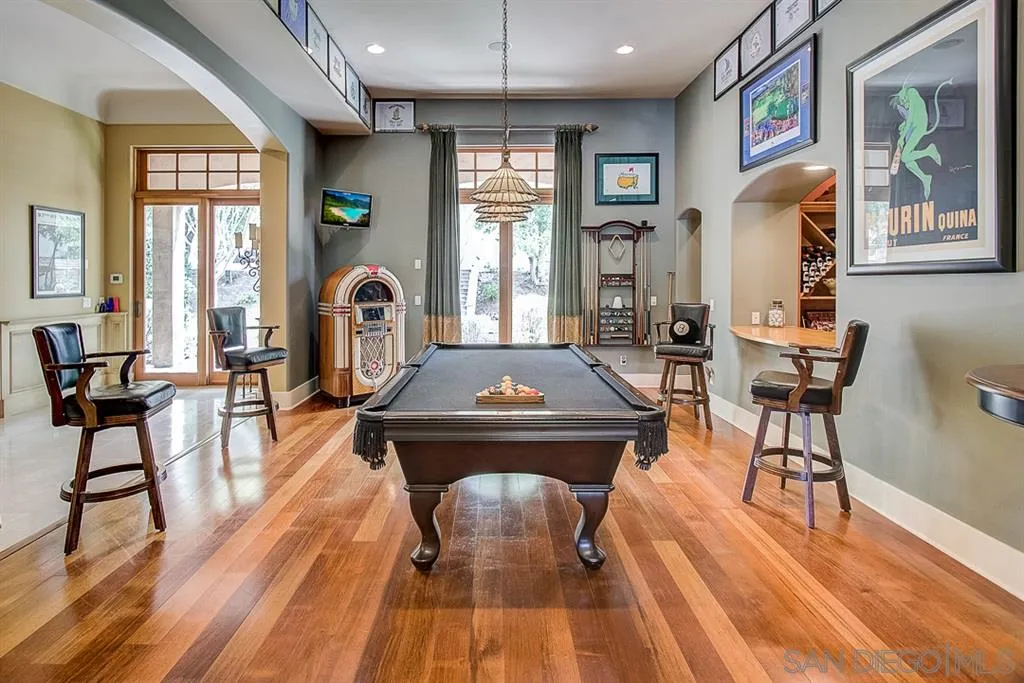 15165 Saddlebrook Lane Poway, CA 92064 - Photo 8 of 25 a living room with furniture a piano and a chandelier