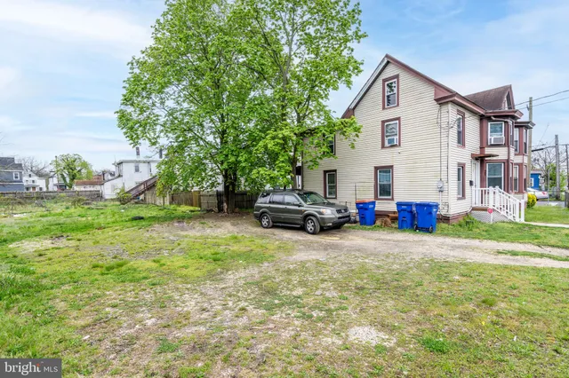 a view of a house with a back yard