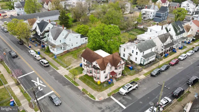 an aerial view of a residential building with an outdoor space